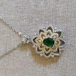 White Rhodium necklace with green emerald and crystals.